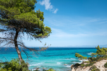 Turquoise beach with rocks . Portokali beach, Sithonia,  Halkidiki, Greece . Sea background 