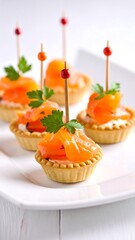 Appetizing salmon tartlets garnished with parsley and red-topped toothpicks