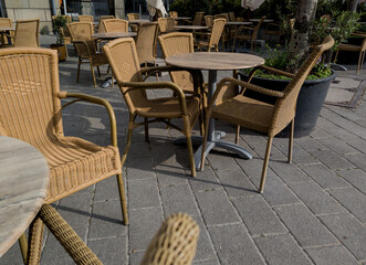 wooden tables and wicker chairs