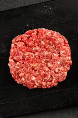 Raw cutlet meat burger ground meat beef, pork fresh natural product tasty snack delicious gourmet food background on the table rustic top view copy space