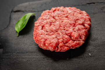 Raw cutlet meat burger ground meat beef, pork fresh natural product tasty snack delicious gourmet food background on the table rustic top view copy space