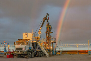 The Northern gas field. Summer. Installation for lowering a flexible pipe into a well. Equipment...