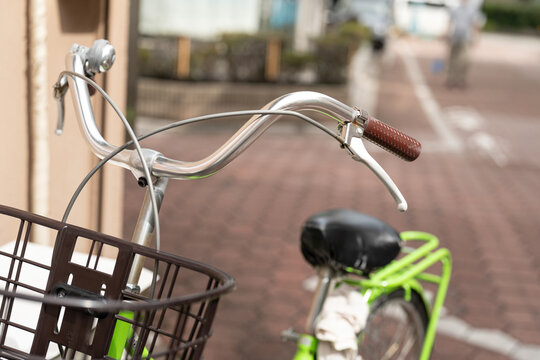 Close-up at handle bar and braking of the classic style housewife bicycle. Transportation equipment object, selective focus.