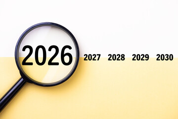 2026 New Year card. New Years goals 2026 with magnifying glass, target icon. Concept 2026 New Year background. Business, resolutions, goals, inspiration, financial, success, ideas