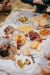 A table full of food with a bottle of mustard on it