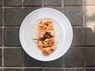 A plate of homemade Japanese Chicken Karaage served with Mentai sauce and white rice