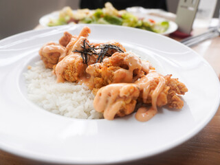A plate of homemade Japanese Chicken Karaage served with Mentai sauce and white rice