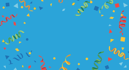 Colorful confetti and streamers are scattered on a blue surface, creating a festive and celebratory.