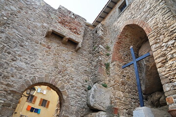 Cross at the entrance to the Aldobrandesca fortress in Giglio Castello, Tuscan Archipelago, Italy