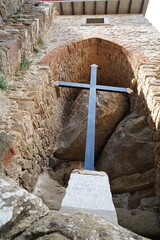 Cross at the entrance to the Aldobrandesca fortress in Giglio Castello, Tuscan Archipelago, Italy