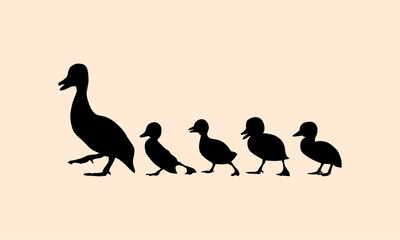 silhouettes of mother duck and ducklings