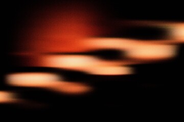 Golden abstract light streaks on dark background, creating motion blur and futuristic glow ideal for modern digital art compositions.