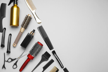 Different hair styling tools on white background, flat lay. Space for text