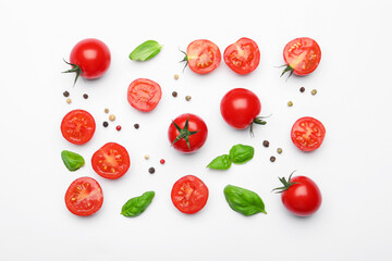 Fresh ripe tomatoes, basil and peppercorns on white background, flat lay