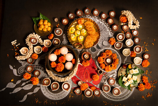 Diwali Rangoli, flowers and sweet 