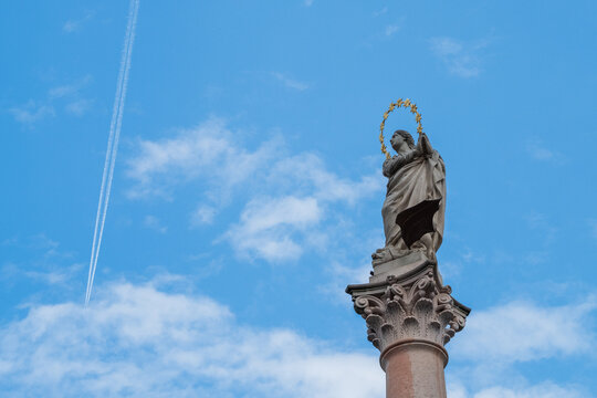 Virgin Mary Statue on Mari�nsk� Sloup Against Blue Sky
