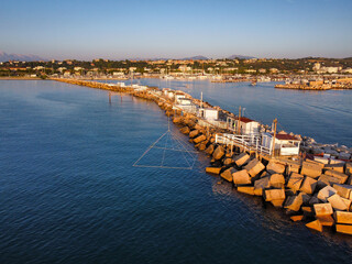 Obraz premium Aerial view of the traditional trabucchi on the pier of the port of Giulianova in Abruzzo.