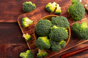 sliced broccoli in wooden bowl on the table,edible green plant in the cabbage family,whose large flowering head.Top view