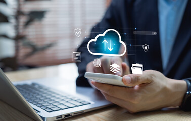 Cloud storage and data backup concept. Businessman managing secure file upload and download in digital cloud system, ensuring data protection, privacy, and online accessibility.