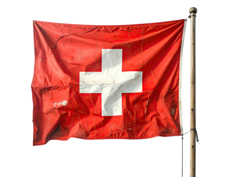 The Swiss flag, a red cloth with a white cross, is blowing in the wind against a black backdrop