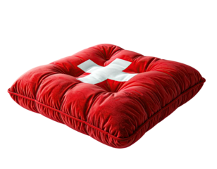 A plush square cushion, vibrant red, with a large white cross emblem, isolated on black