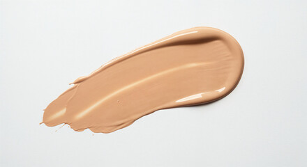 Swirl of beige liquid foundation makeup on white background Keywords: makeup, foundation, liquid