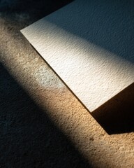 Abstract textured paper with dramatic light and shadows for artistic background design