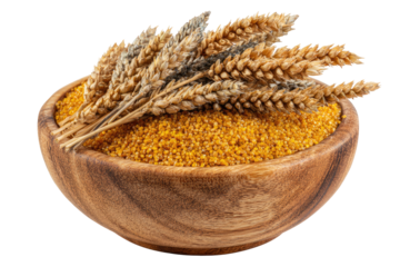 Wooden bowl of yellow grains with wheat stalks