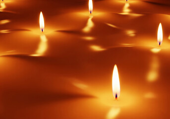 A soft glowing candle light background in cinematic style, perfect for warm spooky atmospheres and Halloween, Ai Generate.