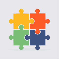 Four Interlocking Puzzle Pieces in Yellow, Red-Orange, Green, and Blue Representing Teamwork, Unity, and Problem Solving