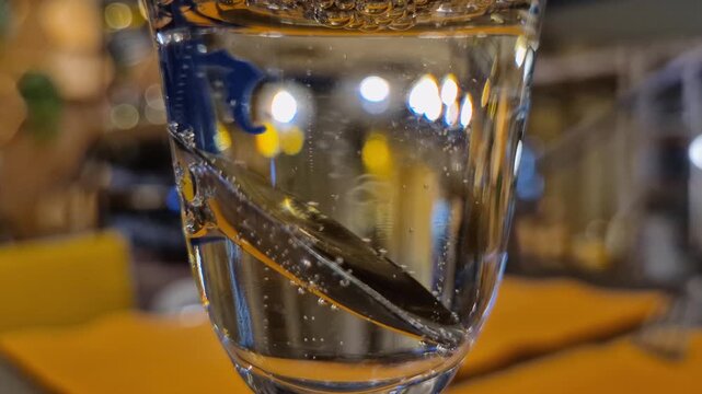 Close-up of bubbles in a glass filled with sparkling wine