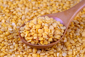 Yellow lentil on the white background