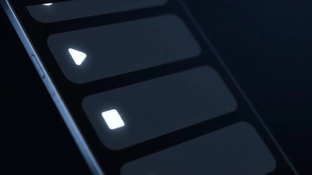 Close Up Of A Dark Modern Smartphone Screen Displaying Glowing UI Elements And Icons With Subtle Blue Lighting And Dark Background