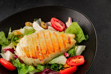 Grilled chicken breast salad chicken breast tomato, green leaf lettuce, salad mix snack vegetable tasty snack fresh gourmet food background on the table rustic top view copy space keto and paleo diet