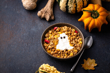 Halloween breakfast. Granola and ghost from yogurt