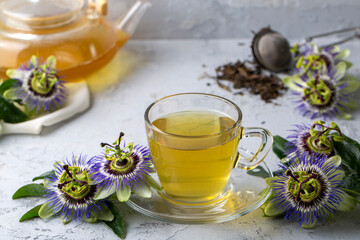 A cup of herbal tea with Passiflora caerulea. Alternative herbal medicine, calming and relaxing effect