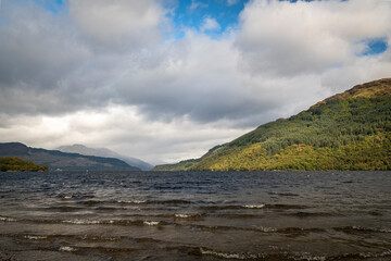A cloudy, autumnal HDR image of Loch Lomond looking north taken from Firkin Point picnic site near Inverbeg, Scotland. 
