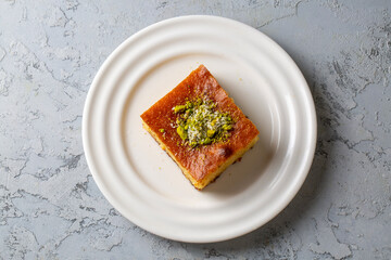Revani - sweet semolina cake with pistachio, traditional turkish dessert
