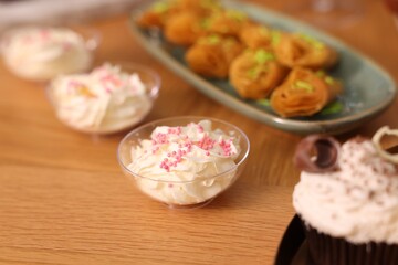 Buffet menu. Different delicious desserts on table, selective focus