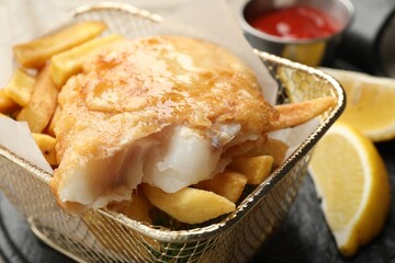 British Traditional Fish and chips served on table, closeup