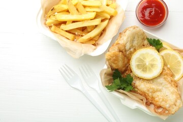 British Traditional Fish and chips served with sauce on white wooden table, flat lay. Space for text