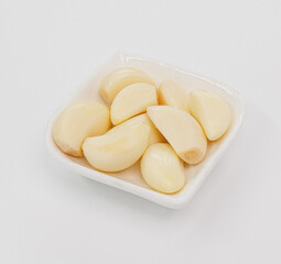Fresh Garlic Cloves in White Bowl Ready for Cooking, Flavorful Dishes, and Everyday Recipes