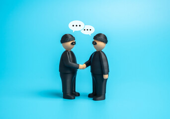 Two robbers agree to cooperate. An organized crime organization. Concept of conspiracy, illegal...