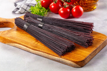 Raw black rice noodles lines