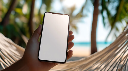 Relaxing with a smartphone on a beach hammock, soaking in the sun and enjoying the coastal scenery. Stay connected while unwinding with the ocean breeze on vacation.