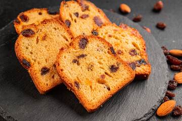 Fruit cake sweet pastry fruitcake dessert dried fruits, nuts traditional baked goods natural product tasty snack fresh delicious gourmet food background on the table rustic top view copy space