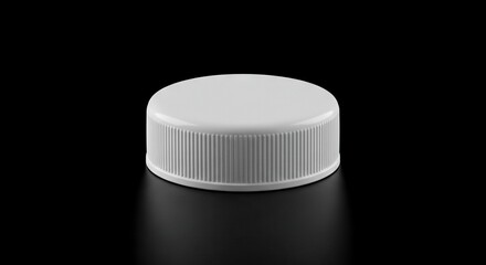 A smooth white plastic bottle cap with vertical ribbed texture on its cylindrical side sits on a black surface