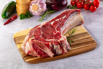 Raw prime beef steak with bone