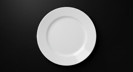 A stark overhead shot features a pristine white round plate against a flat dark gray surface