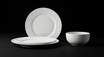 A still life features two plates and a bowl all white on a black surface